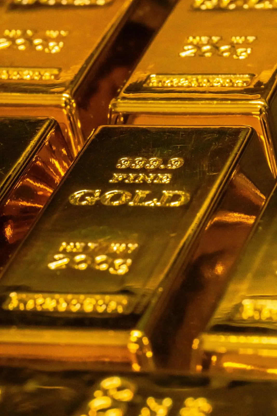 Stacked investment-grade gold bullion bars